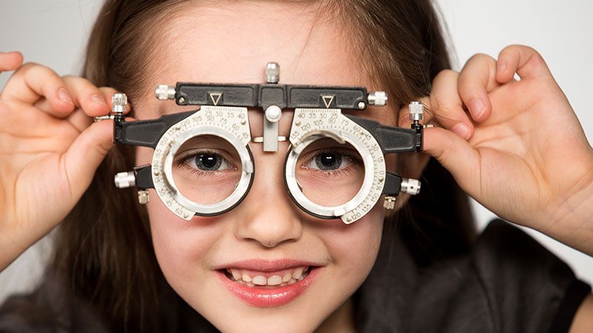 Little girl having an eye check-up