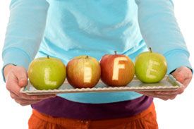 'life' spelled out in apples