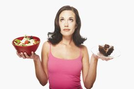 woman choosing between salad and dessert