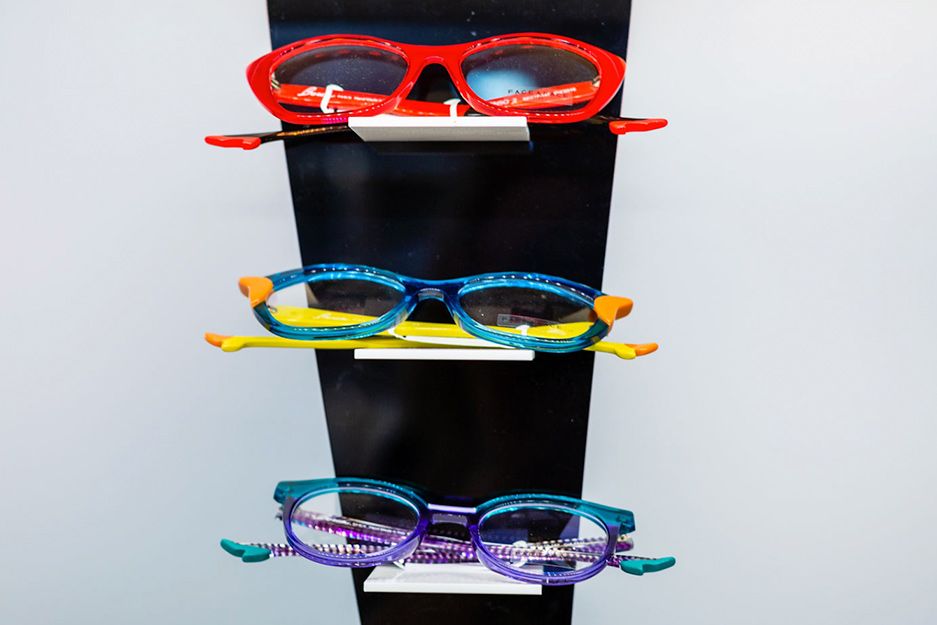 Colorful women’s glasses on display.