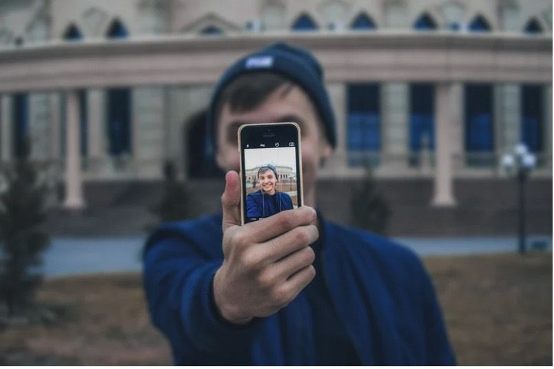 boy taking selfie