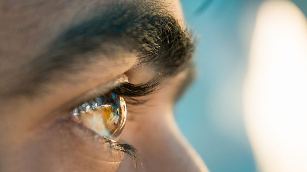 person looking at front with a eye closeup shot