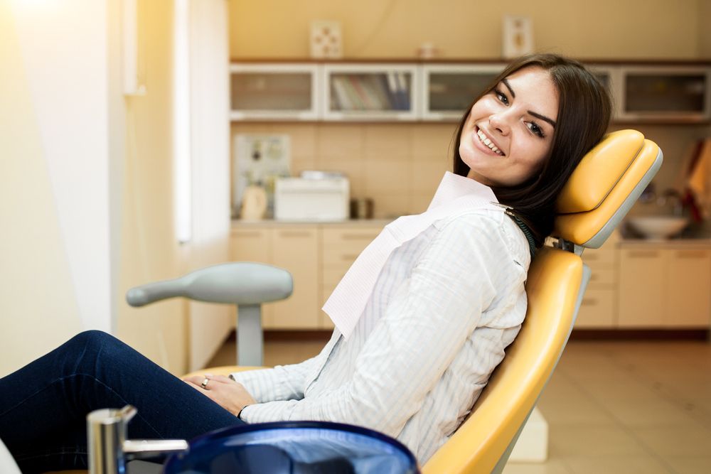 woman with beautiful smile in dental office