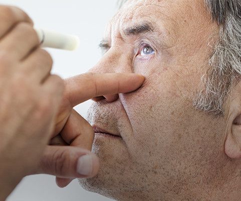 Elderly man getting eye exam