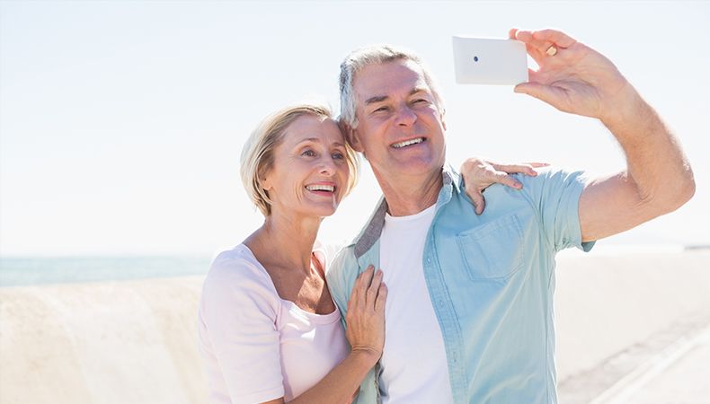 old couple taking a selfie