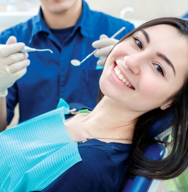 woman smiling getting dental work done