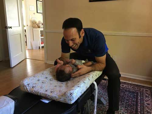 Dr. Ofek Performing Treatment With Baby