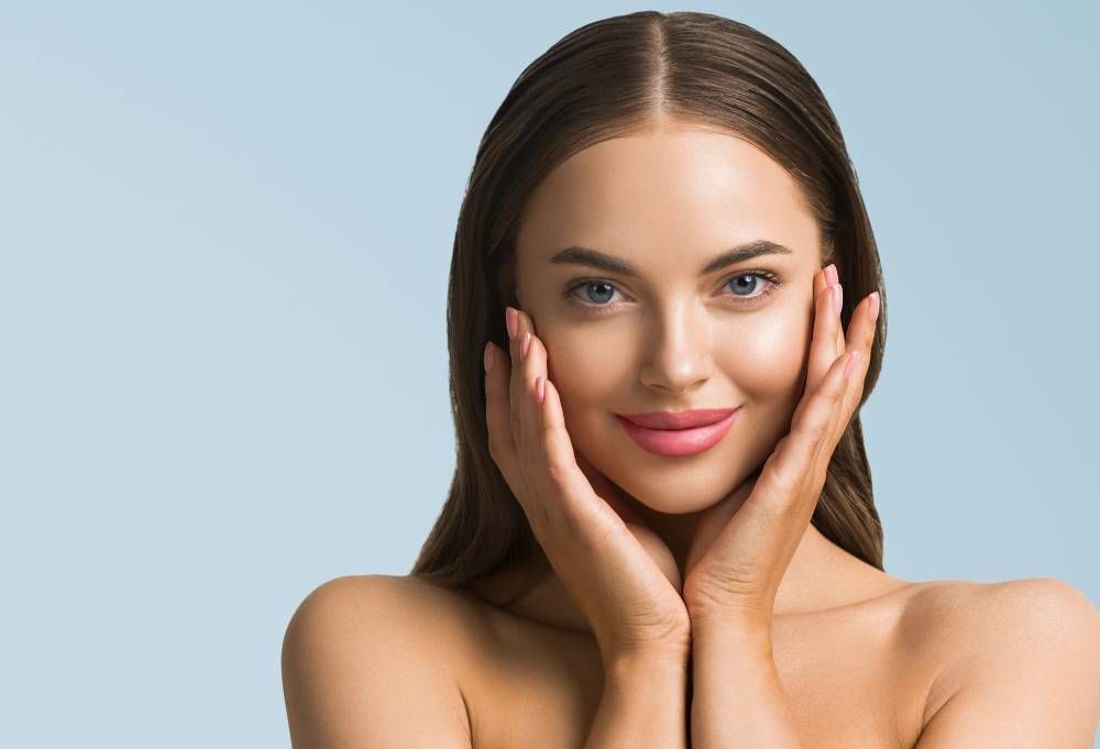women touching clear skin