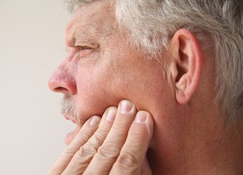 man with toothache