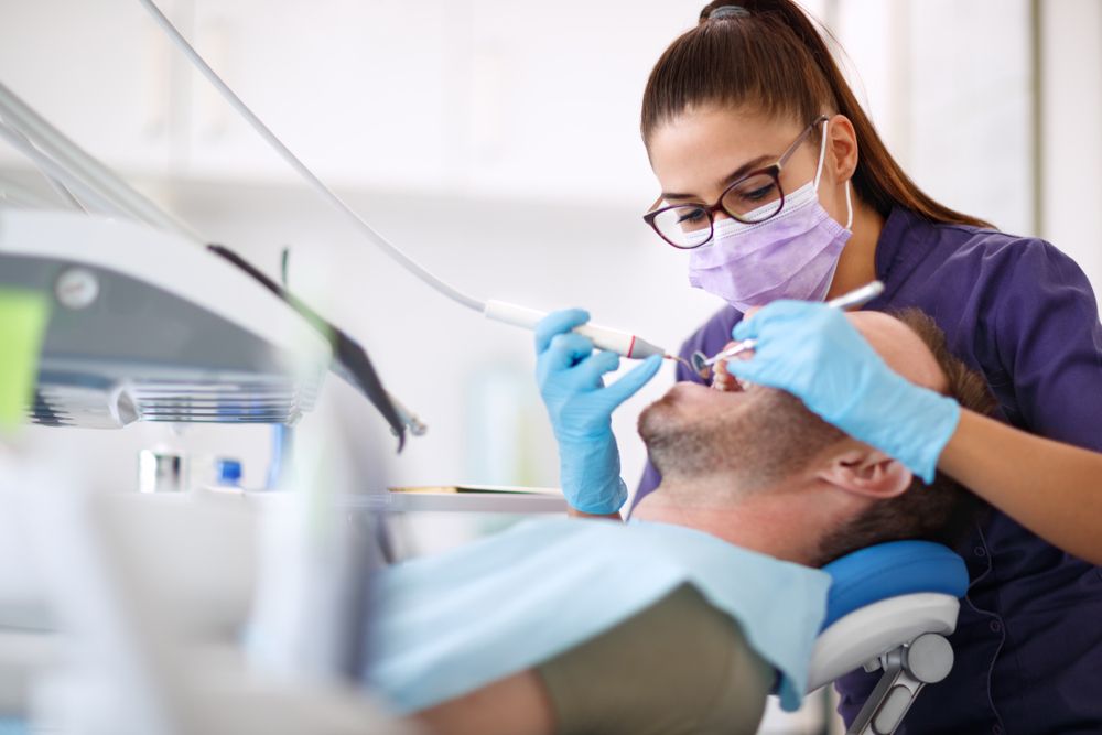 Dentist working on patient