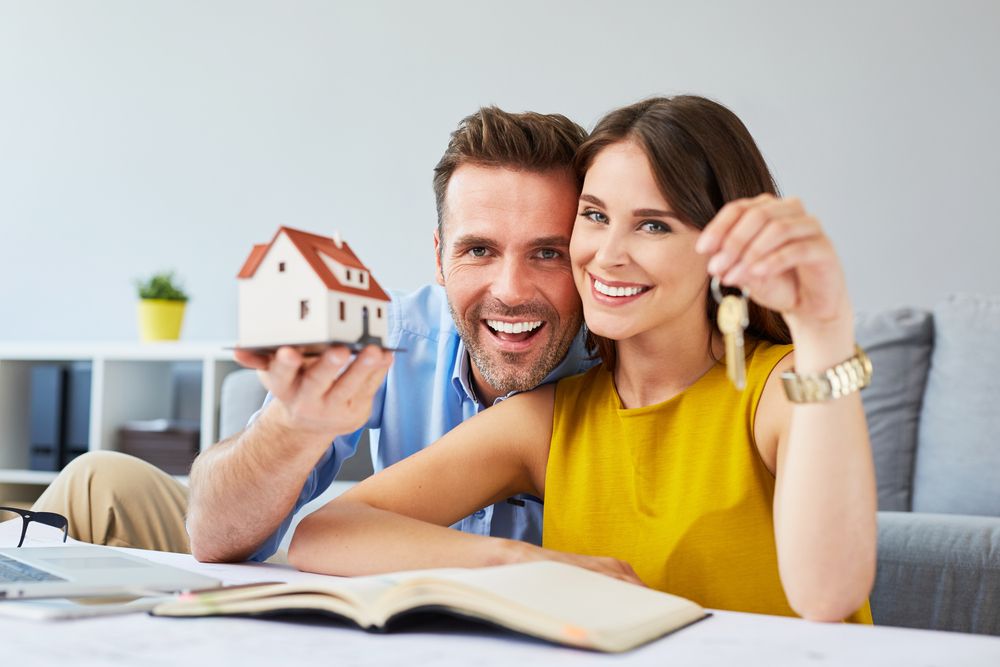 happy couple selling a house