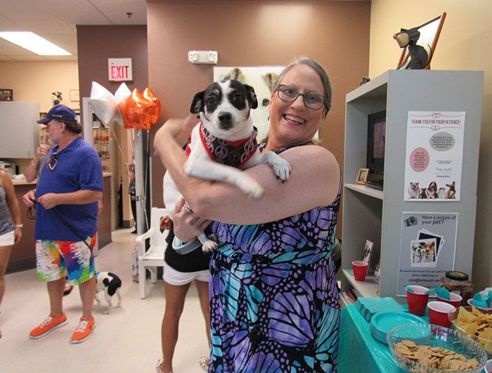 lady holding a dog