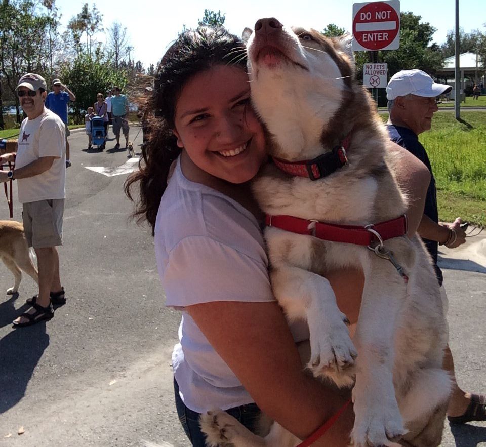 lady hugging a dog