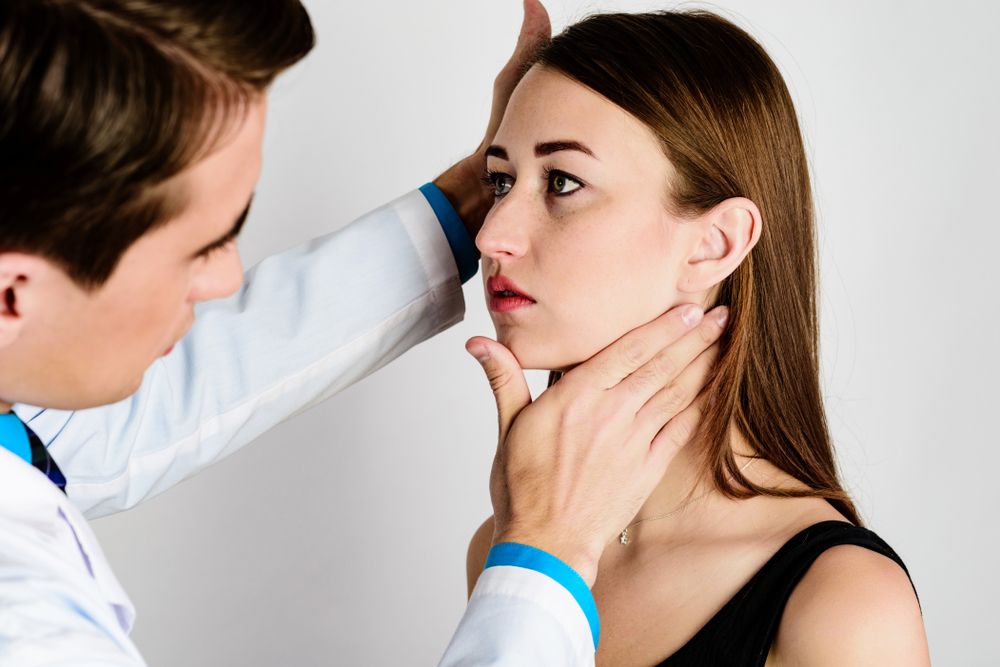 woman at the doctor looking to change her chin shape