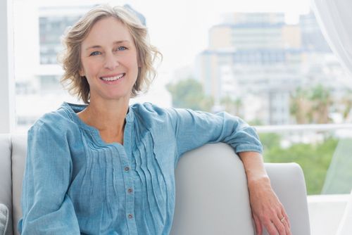 smiling woman with dental implants
