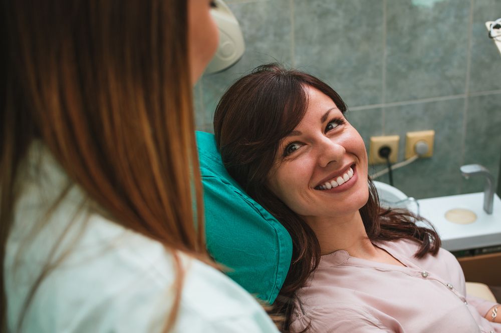 smiling woman in dental clinic
