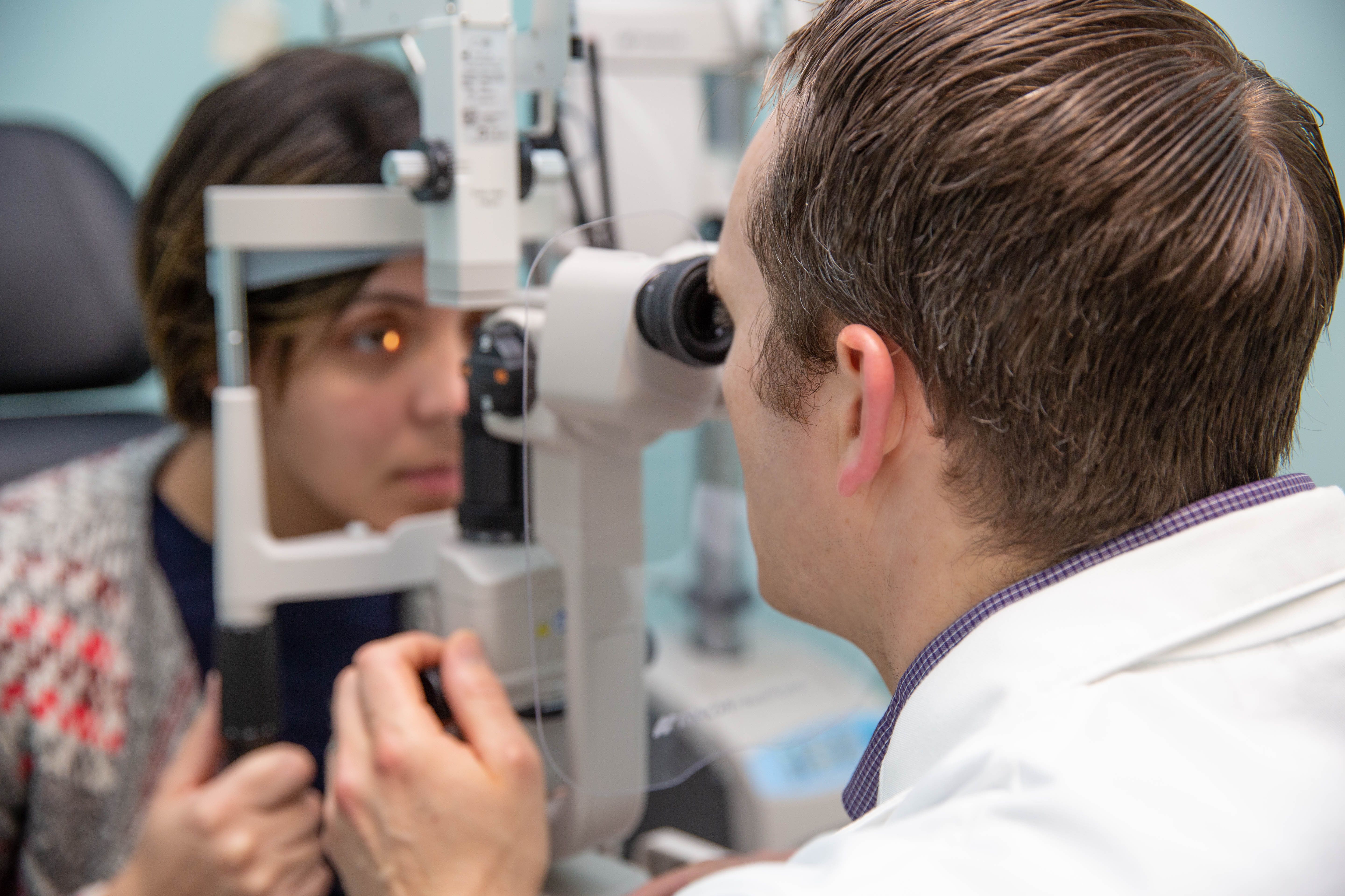 Eye doctor with patient