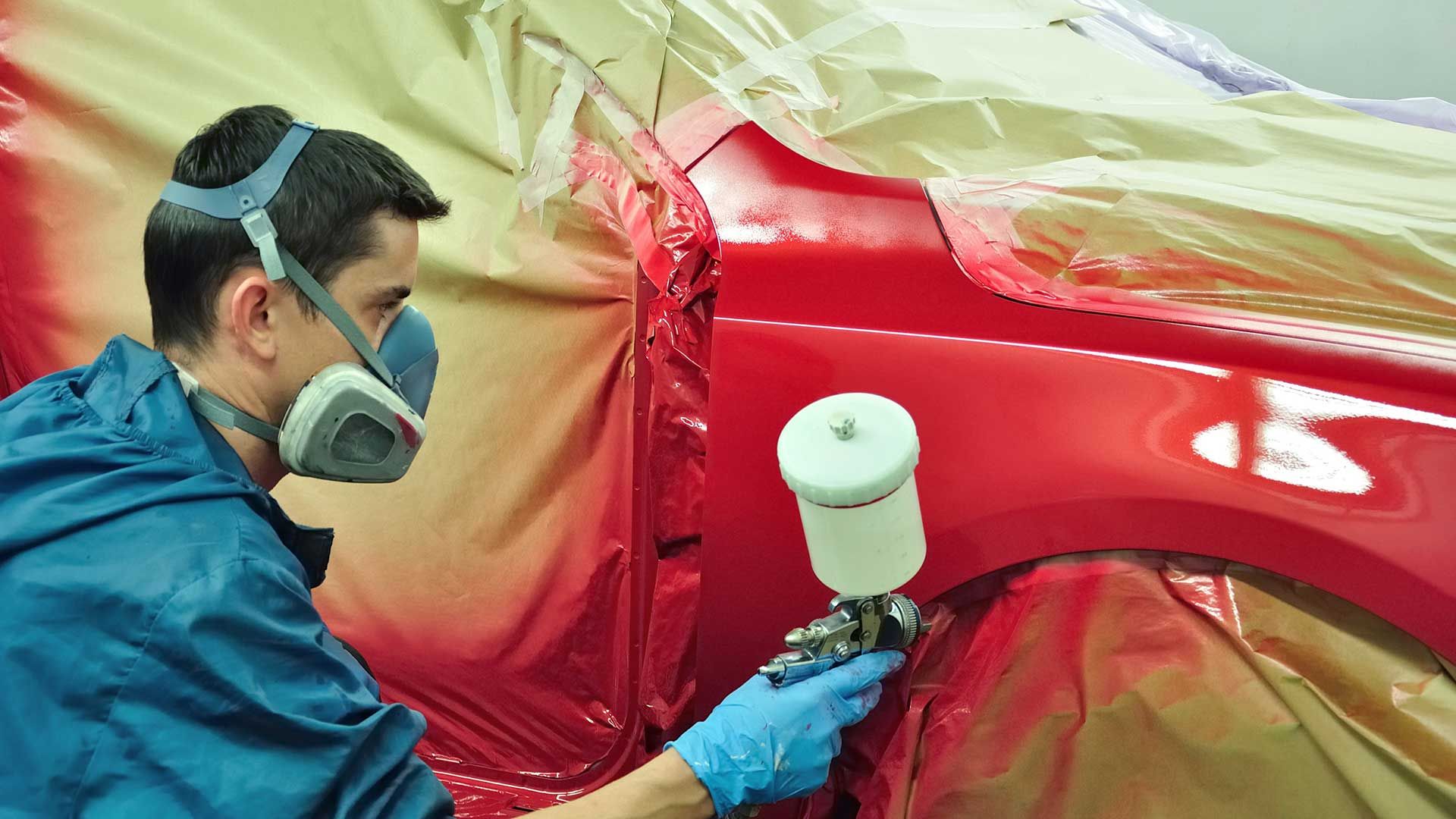 man repainting the car