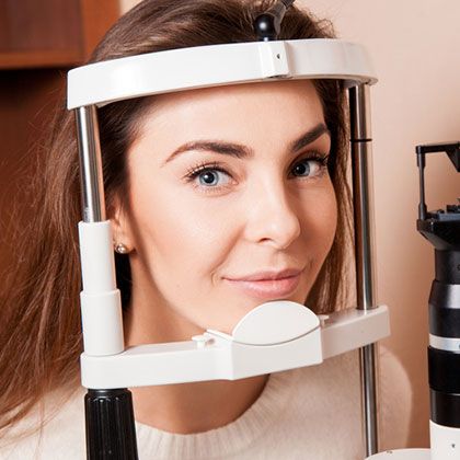 Woman trying glasses out