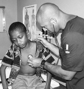 doctor checking the health of a child patient