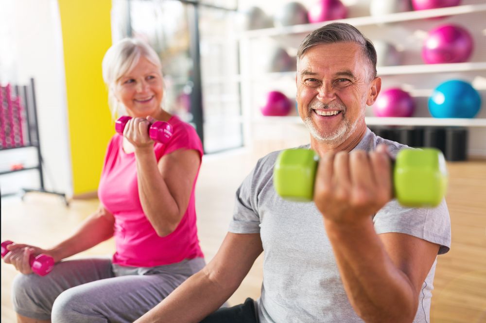 old couple lifting weights