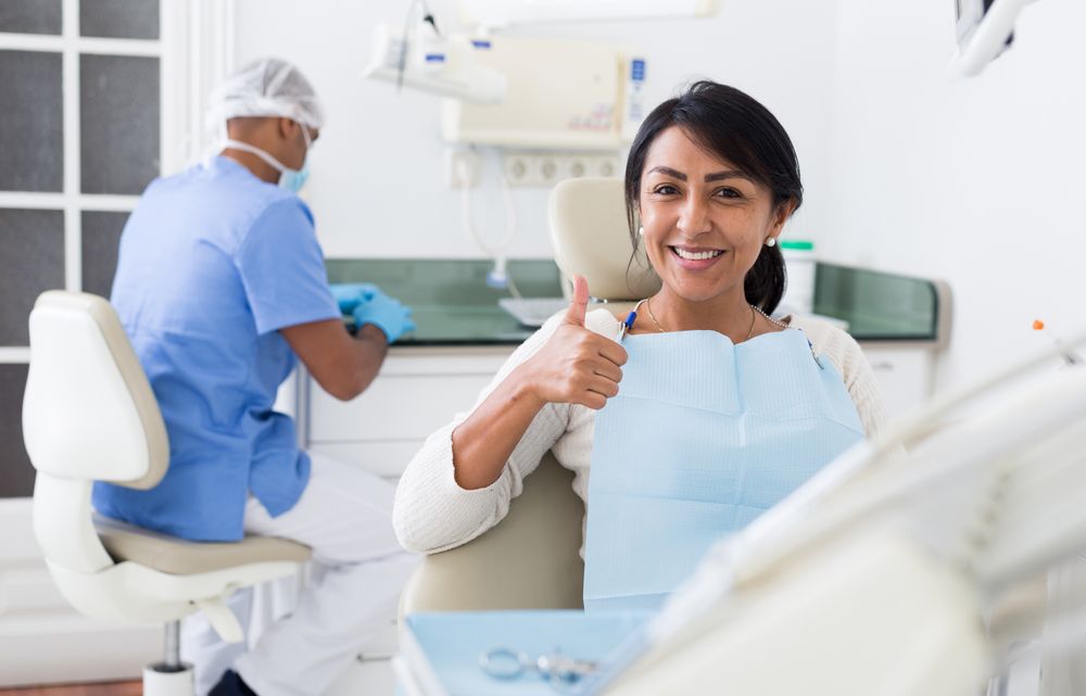 Woman at the dentist getting dental implants
