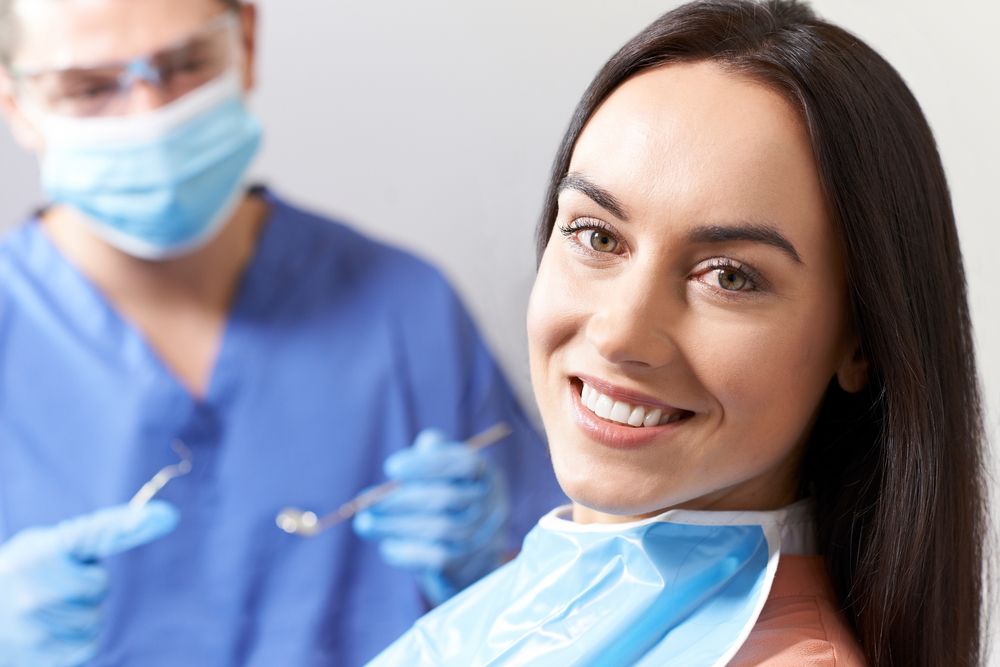 Young Woman Having Check Up And Dental Exam At Dentist​​​​​​​