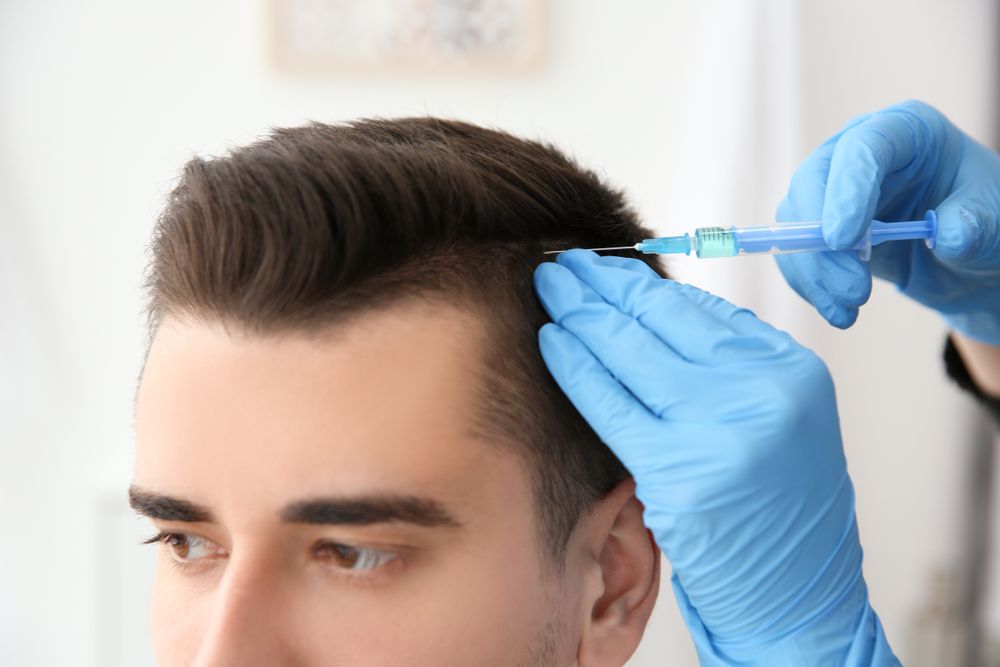 man getting micrograft hair transplant