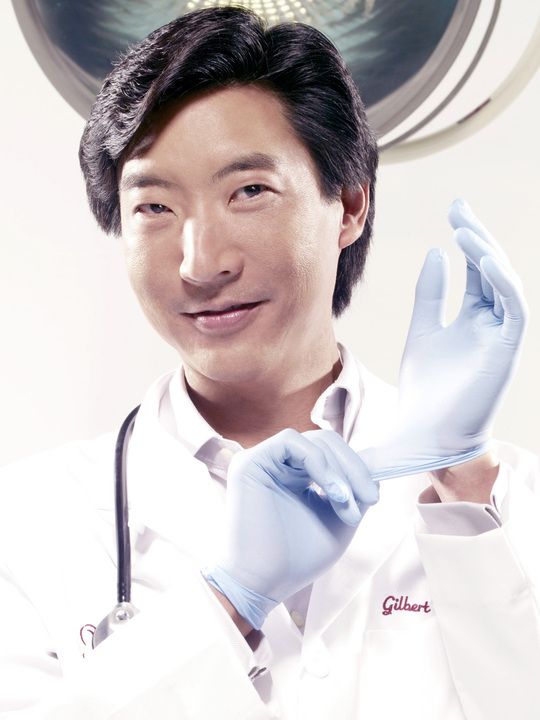 Dr. Gilbert Lee in surgical gloves