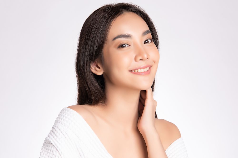 woman with smooth, young-looking face