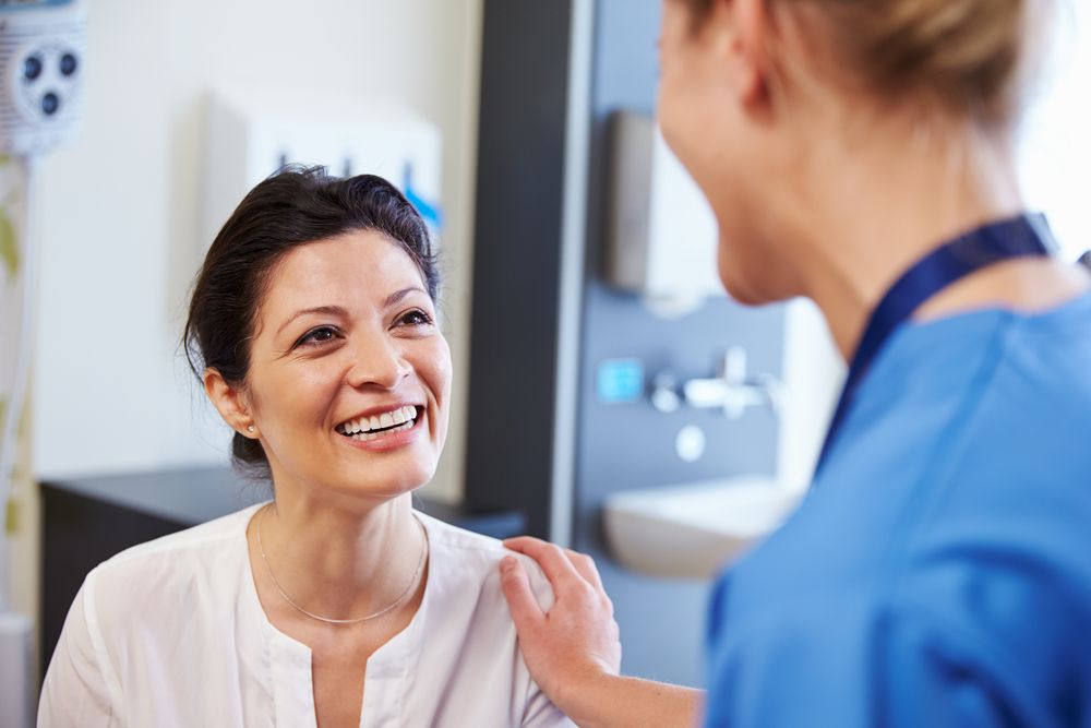 happy woman with eye surgeon