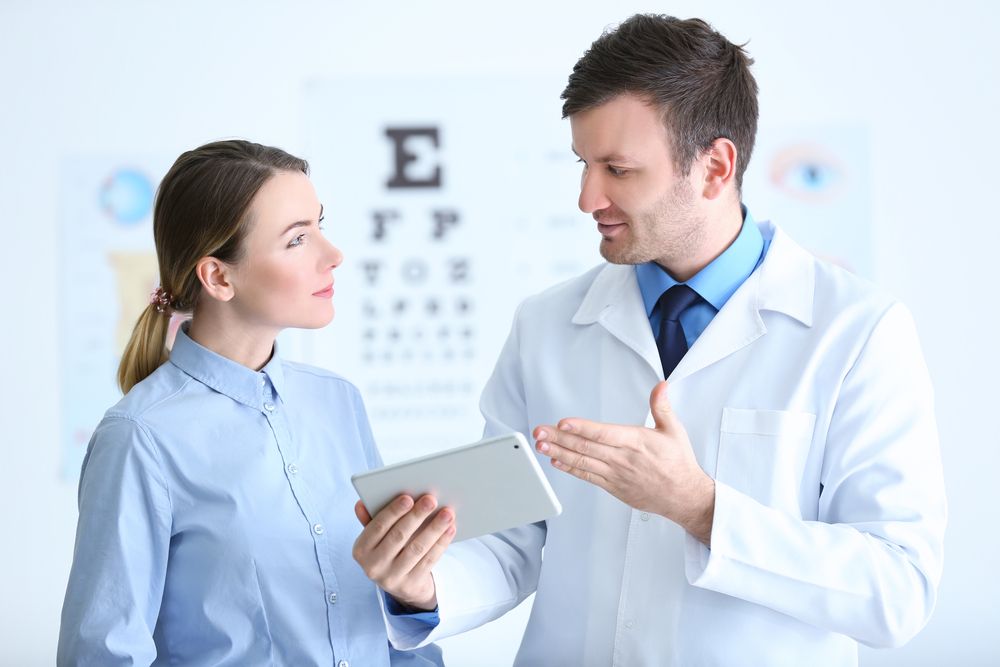 woman listening to her eye doctor