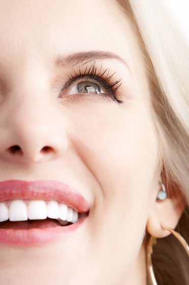 woman looking up and smiling