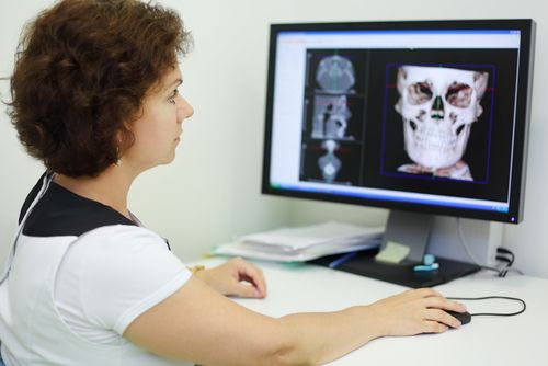 dentist looking at xray results