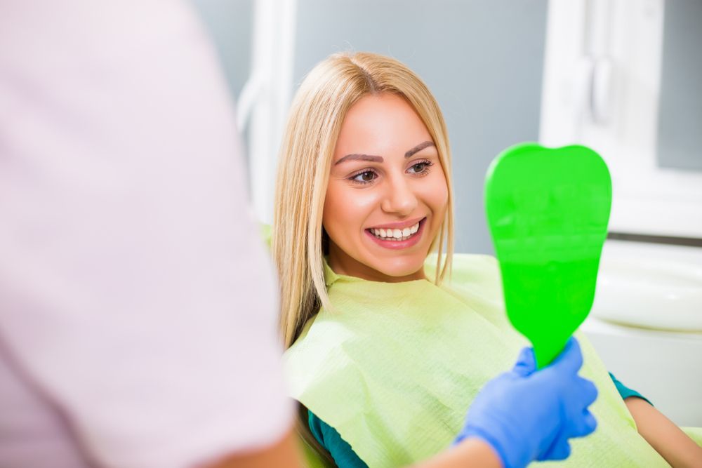 happy woman with dentist