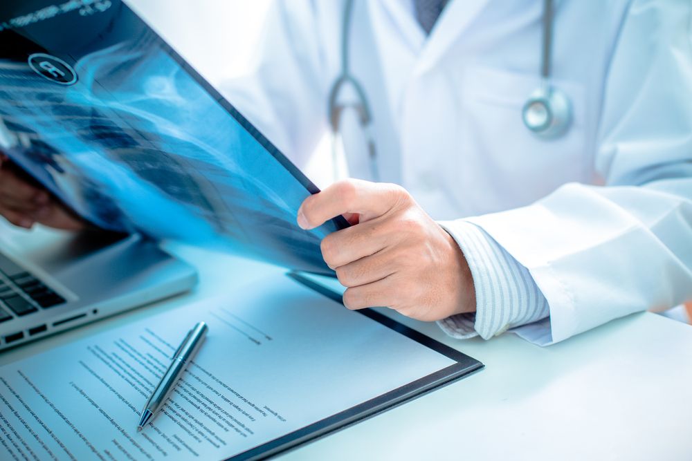 Surgeon viewing x-ray