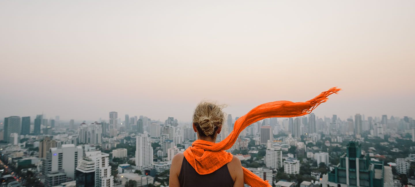 lady peering off into the city