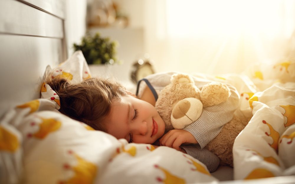 child sleeping with Ortho-K contact lenses in