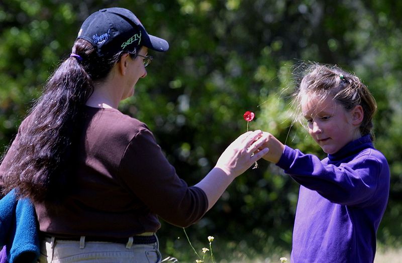 Amy receiving a flower from David