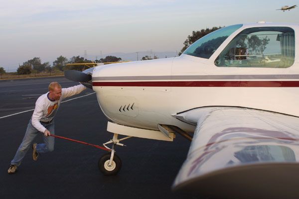 Jim pushing the airplane